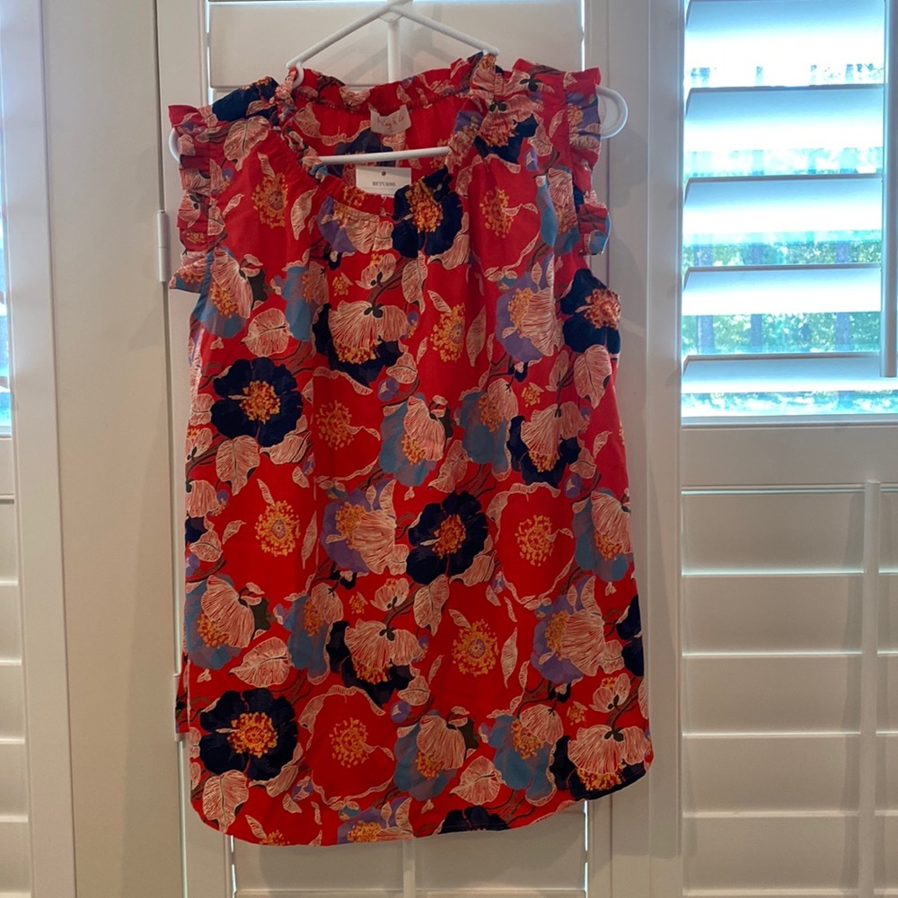 Brand new with tags. Sleeveless blouse.